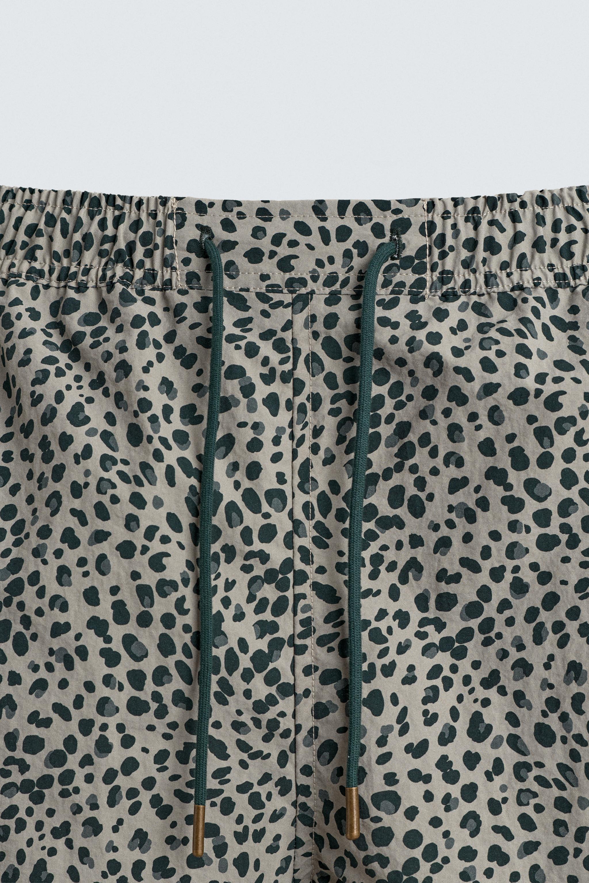ANIMAL PRINT LONG SWIM TRUNKS